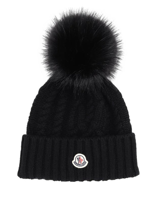 Moncler bonnet en maille torsadée à pompon